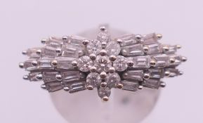 An 18 ct gold and platinum brilliant and baguette cut diamond ring,