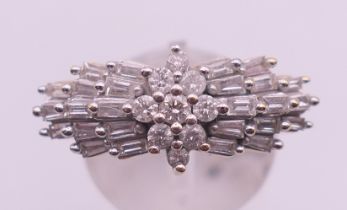 An 18 ct gold and platinum brilliant and baguette cut diamond ring,