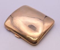 A 9 ct gold cigarette case, the front with engraved initials. 9 cm wide. 69 grammes total weight.