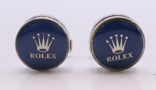 A pair of Rolex cufflinks. 1.5 cm diameter.