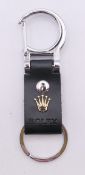 A Rolex keyring in box. 9 cm long.