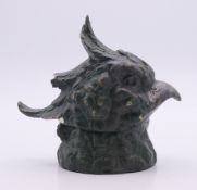 A painted bronze parrot inkwell lid. 8 cm high.