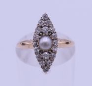 An 18 ct gold, pearl and diamond ring. Ring size J. 2.8 grammes total weight.
