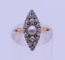 An 18 ct gold, pearl and diamond ring. Ring size J. 2.8 grammes total weight.