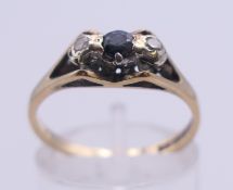 A 9 ct gold, sapphire and diamond ring. Ring size N.