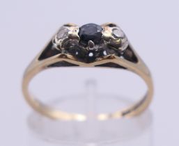 A 9 ct gold, sapphire and diamond ring. Ring size N.