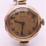 A 9 ct gold cased ladies Rolex 15 jewel manual wind wristwatch. 2.5 cm wide. 21.