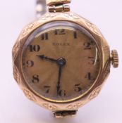 A 9 ct gold cased ladies Rolex 15 jewel manual wind wristwatch. 2.5 cm wide. 21.