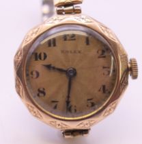 A 9 ct gold cased ladies Rolex 15 jewel manual wind wristwatch. 2.5 cm wide. 21.