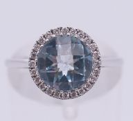 A Luke Stockley 18 ct white gold, topaz and diamond ring. 2.7 grammes total weight. Ring size M.