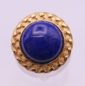A silver gilt lapis lazuli extendable ring.