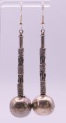 A pair of Balinese silver earrings. 6 cm high.