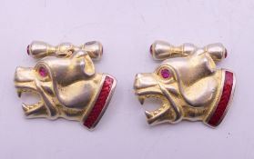A pair of silver dog cufflinks bearing Russian marks. 2 cm high.