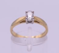 An 18 ct gold and diamond solitaire ring. 3.1 grammes total weight. Ring size N.