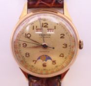 An Orator 18 ct gold gentlemen's moonphase wristwatch. 3.5 cm wide. 44 grammes total weight.