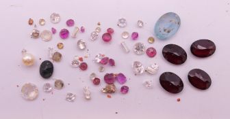A quantity of gemstones including diamonds, sapphires etc.