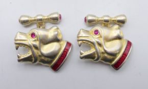 A pair of silver dog cufflinks bearing Russian marks. 2 cm high.