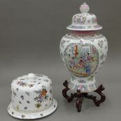 A porcelain cheese bell and a Chinese vase. The latter 31 cm high.