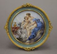 A 19th century finely painted miniature on ivory of Venus and Cupid set in a circular ormolu frame.