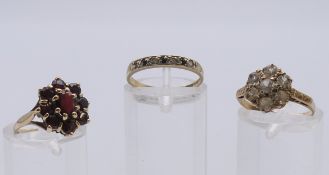 Three 9 ct gold rings. Two ring size J the other K. 5.9 grammes total weight.