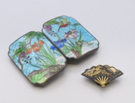 A Japanese Komai fan shaped lapel button badge circa 1900 and a cloisonne buckle decorated with
