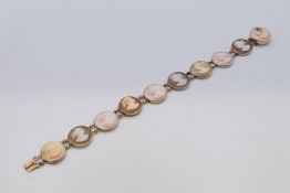 A 9 ct mounted gold cameo bracelet. 18 cm long.