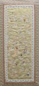 A Chinese silk sleeve panel, framed and glazed. 43 x 77.5 cm overall.