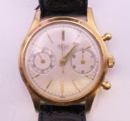 A vintage gold-plated Tag Heuer mechanical chronograph gentlemen's wristwatch. 3.5 cm wide.