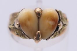 A 14 ct gold animal tooth-set ring. Ring size K.4.1 grammes total weight.