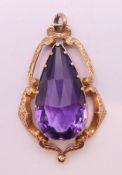 A 14/15 ct gold and amethyst pendant. 4.5 cm high. 8.8 grammes total weight.