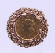 A 9 ct gold 1853 1 dollar coin set ring. Ring size J/K. 9 grammes total weight.