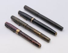 Four vintage fountain pens, including one Waterman's,