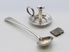 A miniature silver taper stick, a silver mustard spoon and a miniature book of the sights of Rome.