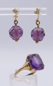 A 9 ct gold and amethyst ring and matching earrings. Ring size M/N.