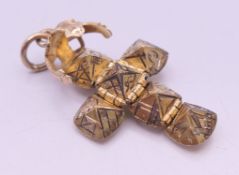 A 9 ct gold and silver Masonic ball pendant stamped 'JHW'. 1.5 cm high.