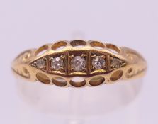 An 18 ct gold, five-stone diamond ring. Ring size O. 1.9 grammes total weight.
