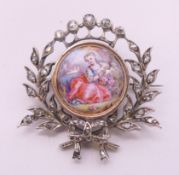 A Victorian diamond and enamel brooch, centred with a reclining girl in a landscape. 3.5 cm wide. 8.
