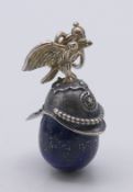 A silver and lapis lazuli helmet pendant. 4.5 cm high.