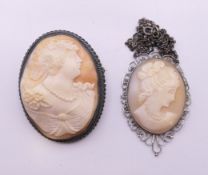 Two silver cameo brooches. The larger 5 cm high.