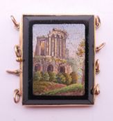 A micro-mosaic and unmarked high carat gold panel. 3 cm wide.