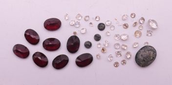 A quantity of gemstones including diamonds, rubies etc.