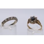 A 9 ct gold dress ring (2.9 grammes total weight) and a 9 ct gold and silver ring.