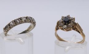 A 9 ct gold dress ring (2.9 grammes total weight) and a 9 ct gold and silver ring.