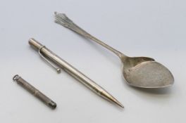 A silver pencil, a silver retractable toothpick and a silver preserve spoon. Pencil 12.