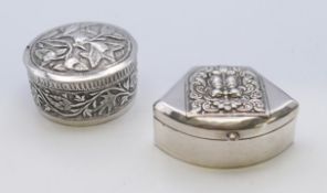 Two vintage unmarked tested silver snuff boxes, one of fan shape,