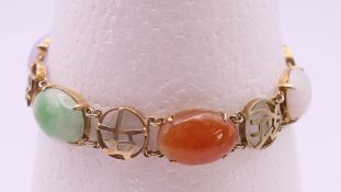 A Chinese silver gilt and jade bracelet. 18 cm long.