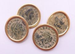 A pair of 18 ct gold and bronze coin-set cufflinks. Each 1 cm wide. 13.6 grammes total weight.