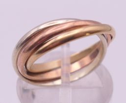 A 9 ct tri-colour gold "Russian" wedding ring. Ring size J/K.