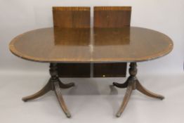 A two-leaf mahogany pedestal dining table. 252 cm long x 100 cm wide.
