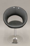 A modern revolving desk chair. 59 cm wide.